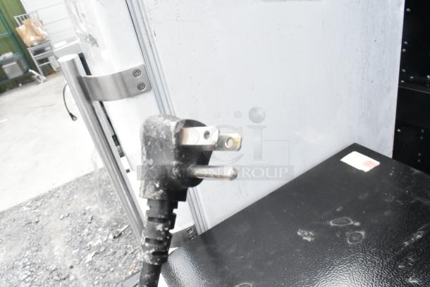 Hisense WMS017M6XBE Mini Cooler, 115V, 1 phase, shown with power plug, stainless handle, and visible exterior markings.