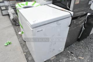 Hisense WFC050M6XWD chest freezer, 115V, white, used condition with visible marks, logo on side, rectangular shape.