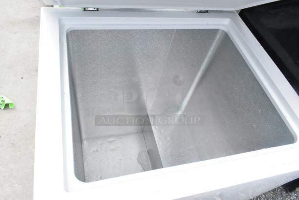 Hisense WFC050M6XWD chest freezer, open lid, pristine interior, 115 volts, 1 phase, excellent condition.