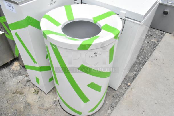 Brand new Lancaster trash can shells, scratch and dent condition, white with green protective tape, auctioned as set of three.