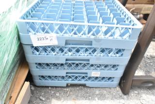 Lot of 4 blue poly dish caddies, brand new with minor scratches. Features tag indicating lot number and quantity. Ideal for dish storage.