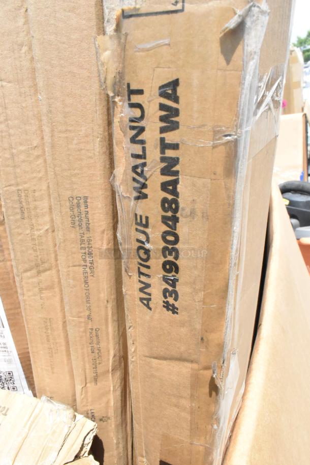 Auction lot of 12 new scratch and dent items, featuring tabletops labeled "Antique Walnut," item #3493048ANTWA.