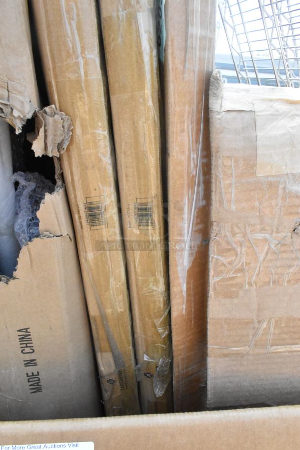 12 new scratch and dent items including tabletops, stainless steel tables, and Metro shelves in original packaging, "Made in China."