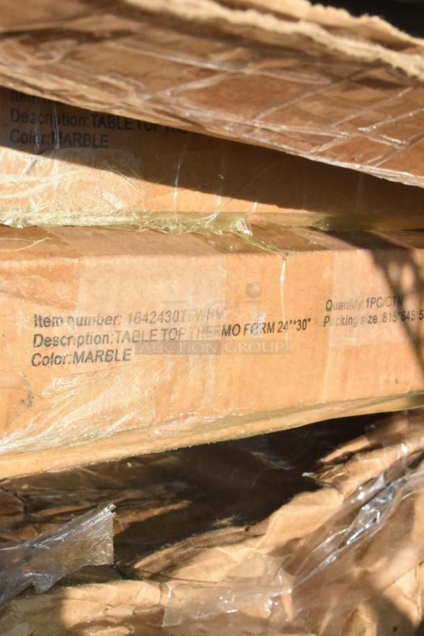 Cardboard box with label showing tabletop, thermo form 24"x30", color marble. New condition, part of scratch and dent lot.
