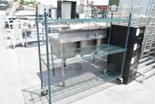 Metro Green 3-tier wire shelving unit on commercial casters, suitable for storage. Dismantling required by buyer.