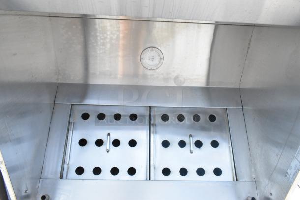 4' stainless steel CaptiveAire 4830 ND-2 grease hood with filters, showing perforated filter panels, in good condition.