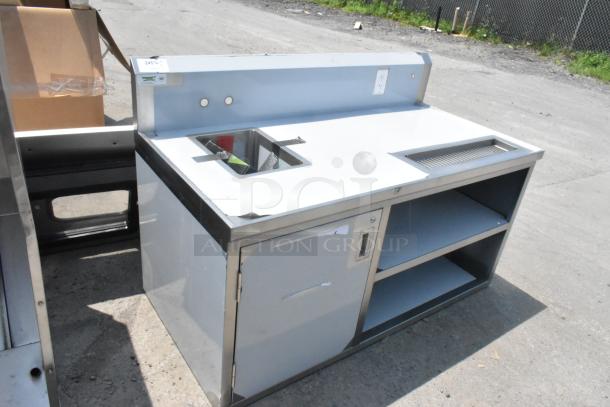 Brand new Regency 600TBV3060L 30" x 60" stainless steel beverage table with left sink, slight dents visible.