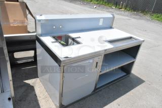 Brand new Regency 600TBV3060L 30" x 60" stainless steel beverage table with left sink, slight dents visible.