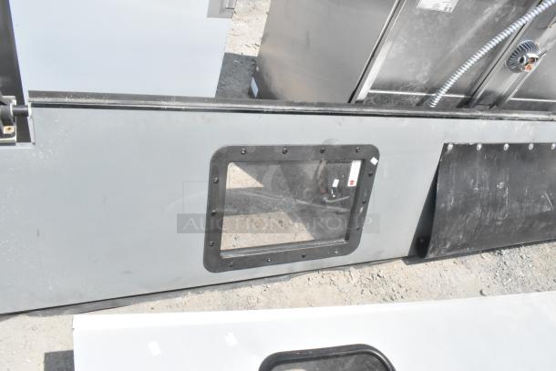 Two swinging kitchen doors, gray metal with windows, used condition. Includes hardware, bid doubles quantity.