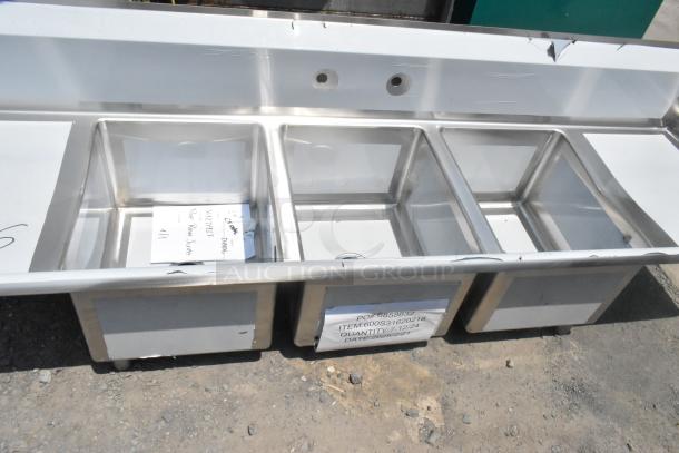 BRAND NEW Regency 600S31620218 stainless steel 3 bay sink with dual drain boards, no legs, tags showing model number.