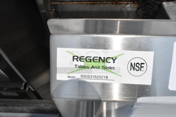 Brand new Regency 600S31620218 stainless steel 3 bay sink, features dual drain boards, no legs, scratch and dent condition.