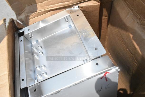 10 brand new scratch and dent items in a box, including stainless steel components, showing minor wear; auction lot.