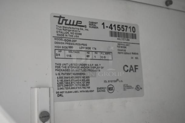 Label of True GDM-23F cooler, showing voltage (115V), phase (1), and design pressures. NSF certified for packaged products.