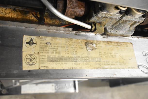 Garland SunFire SD6-1 convection oven label showing model, 80,000 BTU, and installation instructions. Some wear visible.