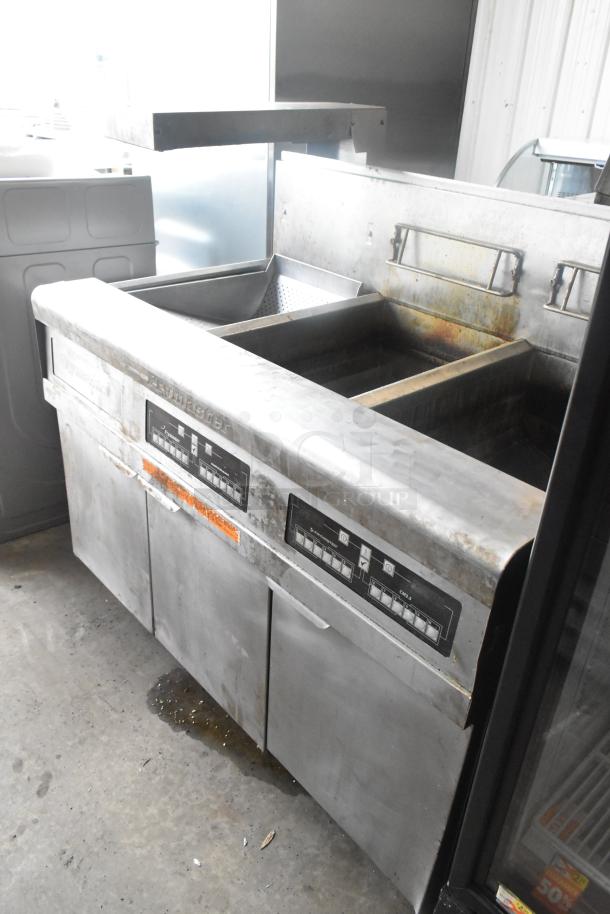 Frymaster FMPH255CSC 2-bay deep fryer with dumping station; stainless steel; 80,000 BTU; commercial casters; natural gas-powered.