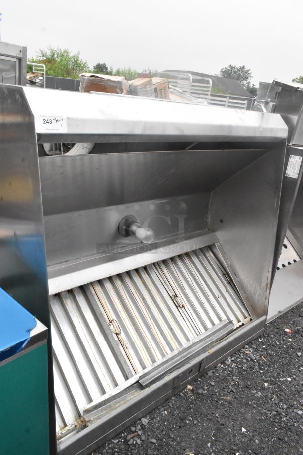 5' stainless steel grease hood with filters and light, in good condition. Visible tags indicate auction lot number.