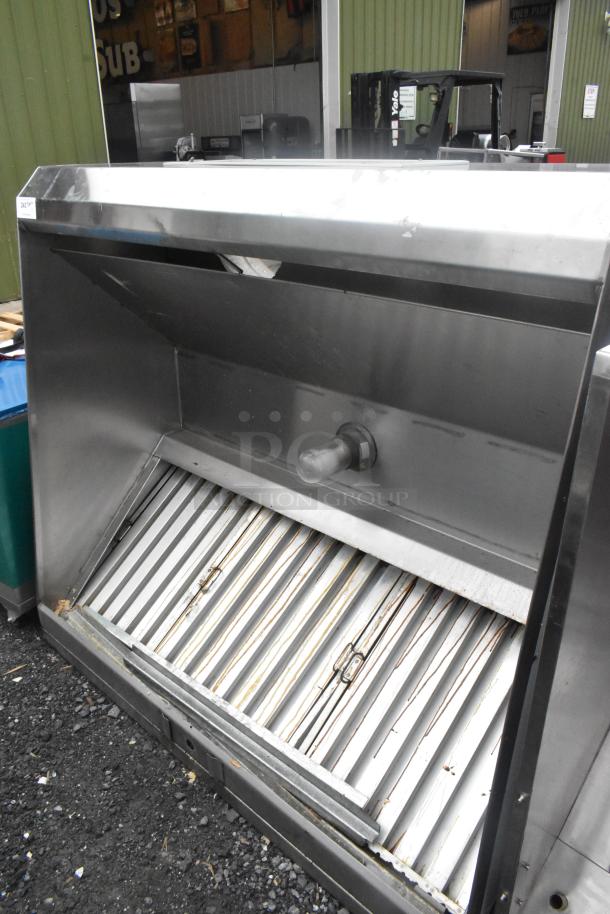 5' stainless steel grease hood with filters and light, showing minor wear. Suitable for commercial kitchens.