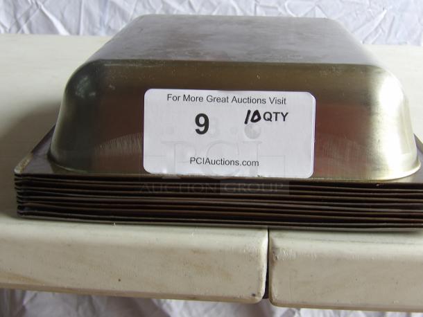 Commercial stainless steel steam table pans, stack of 10. Each pan labeled "10 QTY" on PCI Auctions sticker.