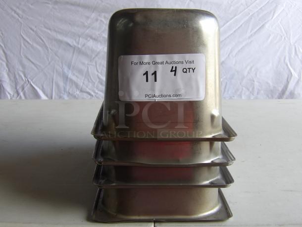 Commercial stainless steel steam table pans, set of 4. Stackable, durable design with visible label: "11 4 QTY."