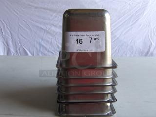 7 commercial stainless steel steam table pans stacked on a table. Tag reads "7 QTY." Excellent condition.