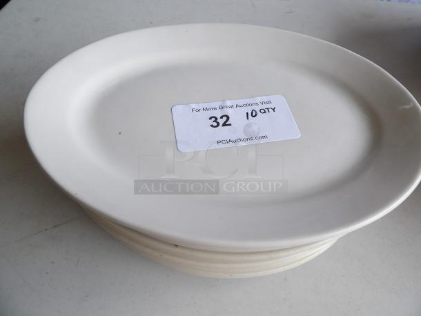 Ivory stoneware platter, 12.5" x 8.875", wide rim, rolled edge. Lot of 10. Label shows auction info "32 10 QTY".