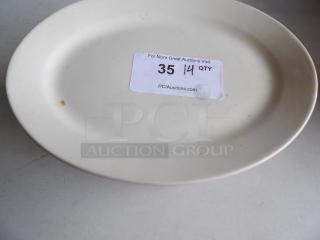 Ivory stoneware platter, 12.5"x8.875", wide rim, rolled edge. Slight wear visible, auction tag "35 14 QTY".