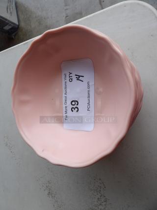Pink ceramic bowl with a wavy rim, part of a set of 14. Auction label indicates "QTY 14, Item 39, PCIauctions.com."