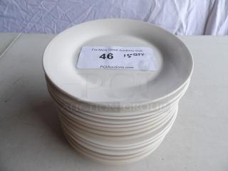 Stack of 15 bright white 7 1/8" stoneware plates with wide rim and rolled edge. Tag indicates "15 QTY."