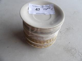 Stack of 16 bright white embossed 6" porcelain saucers, in good condition. Auction label shows "47" and "16 QTY."