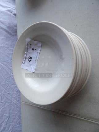 9 bright white stoneware bowls with wide rolled edges for soup and pasta. Each bowl marked with auction tag "Lot 49".