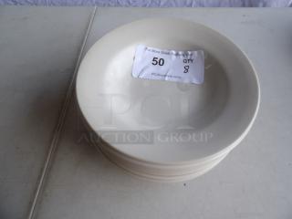 8 bright white stoneware soup bowls, 10 oz. each, wide rim, rolled edge. Condition: good. Label shows quantity 8.