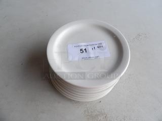 8 1/4" white stoneware plates, wide rim, rolled edge, set of 11, stacked. Sticker indicates auction item number 51.