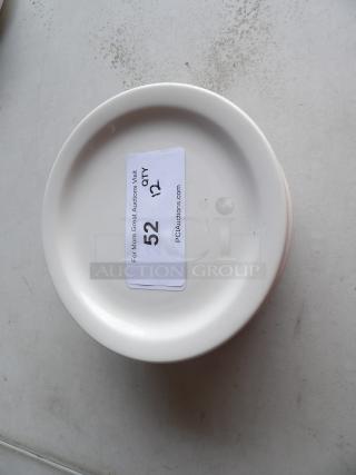 8 1/4" bright white stoneware plate with wide rim, rolled edge. Good condition. Quantity label indicates set of 12.