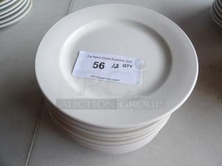 9" bright white wide rim rolled edge stoneware plate stack. Includes auction label, "56, 12 QTY."