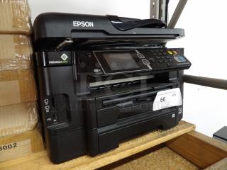 Epson Workforce WF-3640 printer, black, powers on. Features PrecisionCore technology, visible Wi-Fi and control panel.