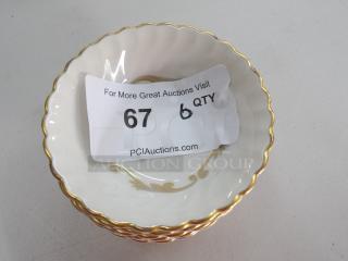 Small decorative dessert bowls with gold trim and floral design. Includes 6 bowls. Auction label indicates quantity 6.