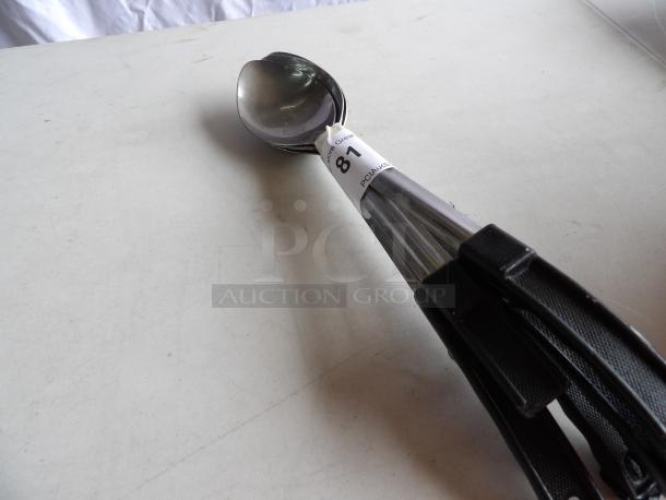 Set of five 13" solid stainless steel basting spoons with coated handles, label visible, excellent condition.