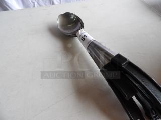 Set of five 13" solid stainless steel basting spoons with coated handles, label visible, excellent condition.