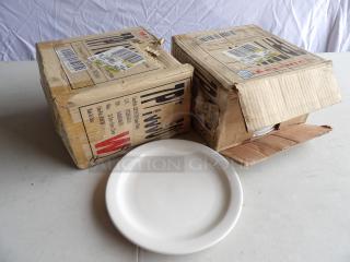 New in box 8" dessert plates, set of 24. Plates appear unused, packaging indicates "Pressure Porcelain White."