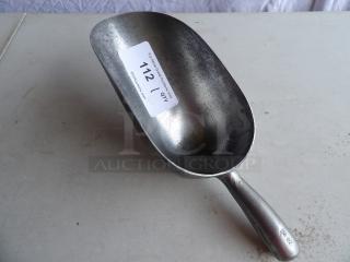 58 oz. aluminum scoop with ergonomic handle, showing moderate wear. Sticker with auction info on scoop.