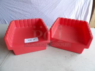 Two red hard plastic booster seats with ribbed design, in good condition. Auction tag indicates quantity of two.
