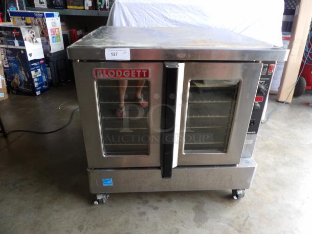 Blodgett Zephaire stainless steel electric convection oven, single stack on casters, with wired racks, visible wear.
