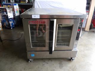 Blodgett Zephaire stainless steel electric convection oven, single stack on casters, with wired racks, visible wear.
