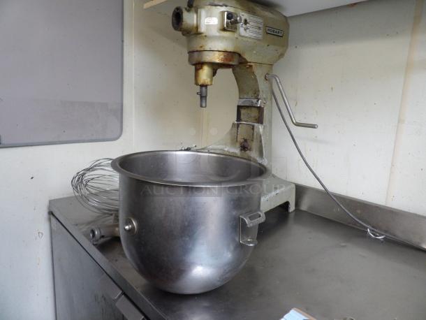 Hobart A-200 20Qt commercial mixer with attachments and stainless steel bowl, in used condition, showing wear.