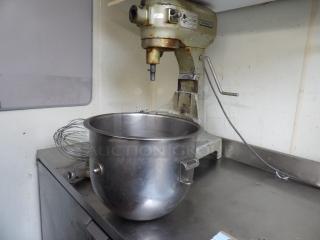 Hobart A-200 20Qt commercial mixer with attachments and stainless steel bowl, in used condition, showing wear.