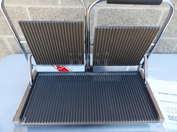 New Kratos 29Y-023 commercial panini grill with grooved plates, scratch & dent condition, includes user's manual.