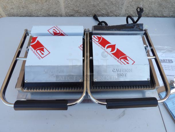 Kratos 29Y-023 commercial double countertop panini grill, grooved plates, new scratch & dent, caution hot label visible.