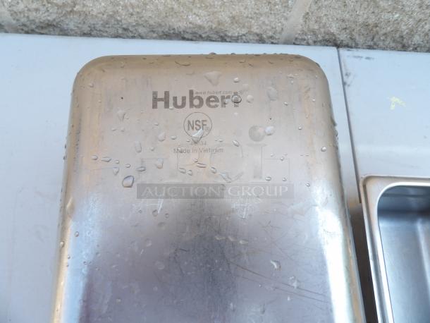 Huber stainless steel steam pan, NSF certified, marked "Made in Vietnam," slightly wet surface, excellent condition.