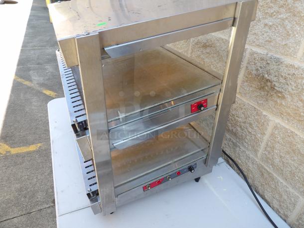 Nemco 6480-30S Commercial Stainless Steel 2-Tier Heated Display Case, rear access, on legs, powers on, countertop unit.