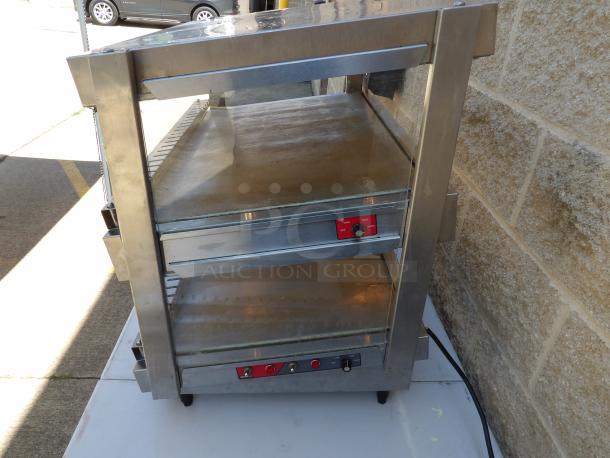 Nemco 6480-30S stainless steel 2-tier heated display case, rear access, electric powered, on legs, good condition.
